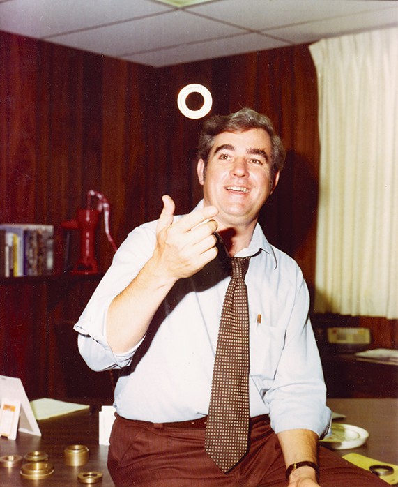 David C. Orlowski flipping a Bearing Isolator in his office, Rock Island, IL